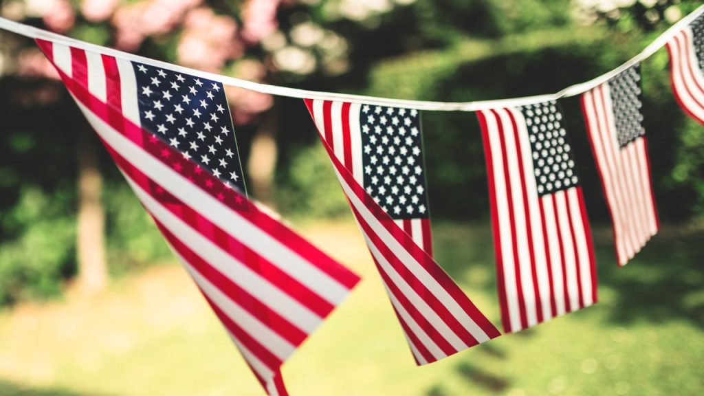 Decoration of American flags hanging on a line.