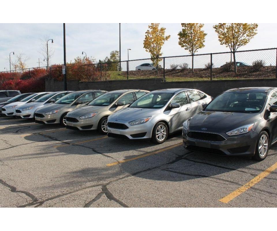 A row of fleet vehicles for a U-M Fleet Vehicle auction.
